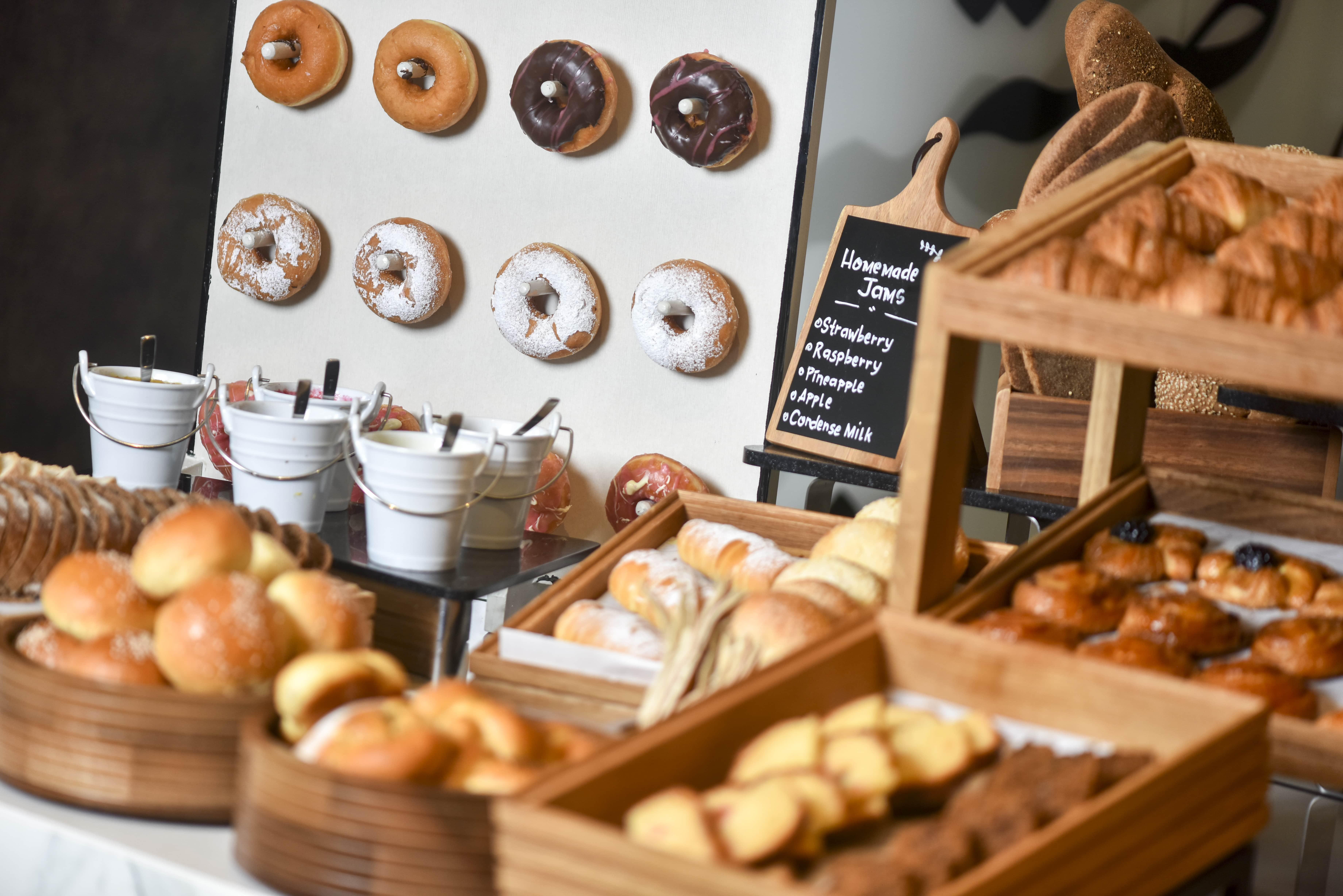 Voco Doha West Bay Suites By Ihg Exterior photo A selection of pastries at a bakery