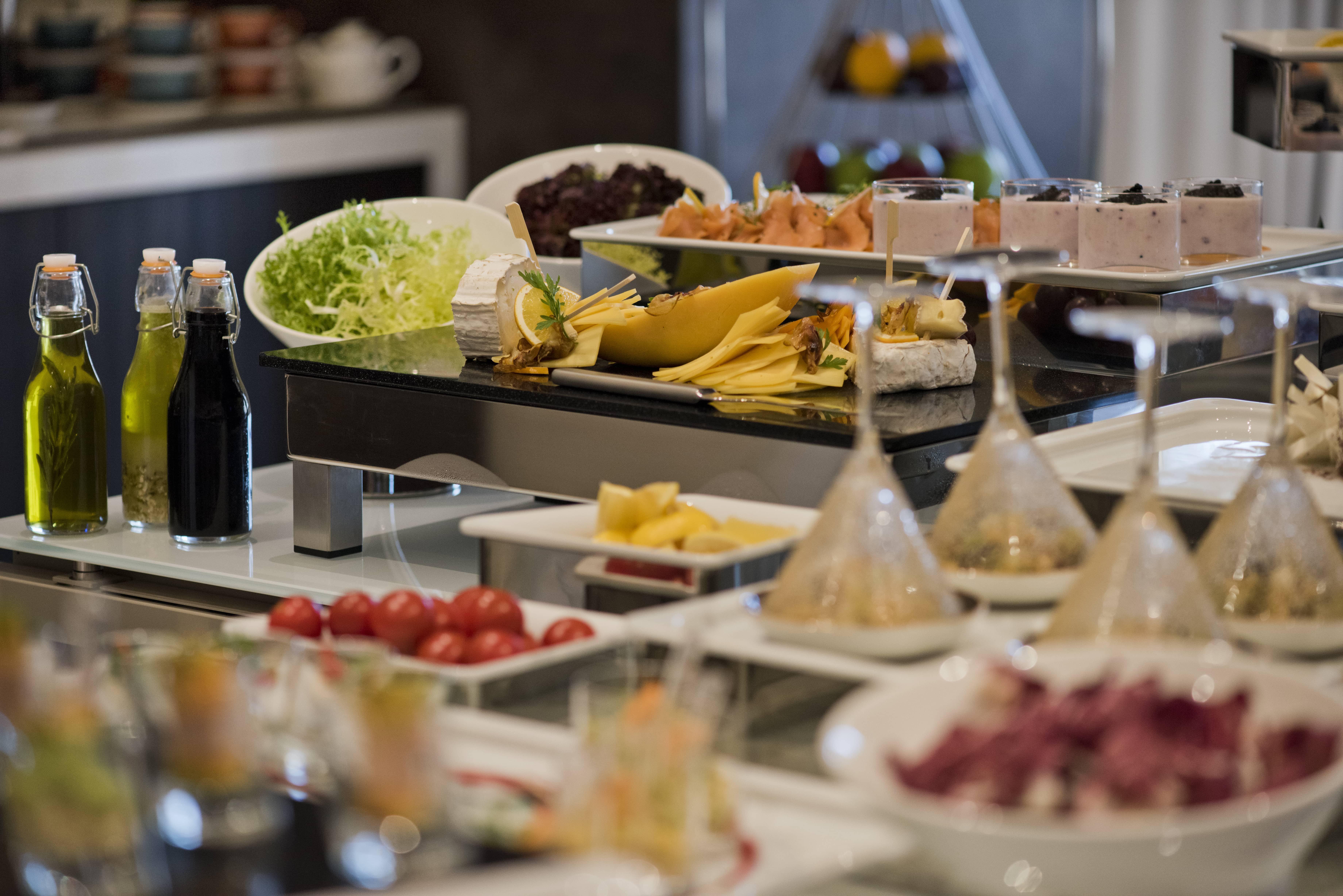 Voco Doha West Bay Suites By Ihg Exterior photo A buffet at a hotel