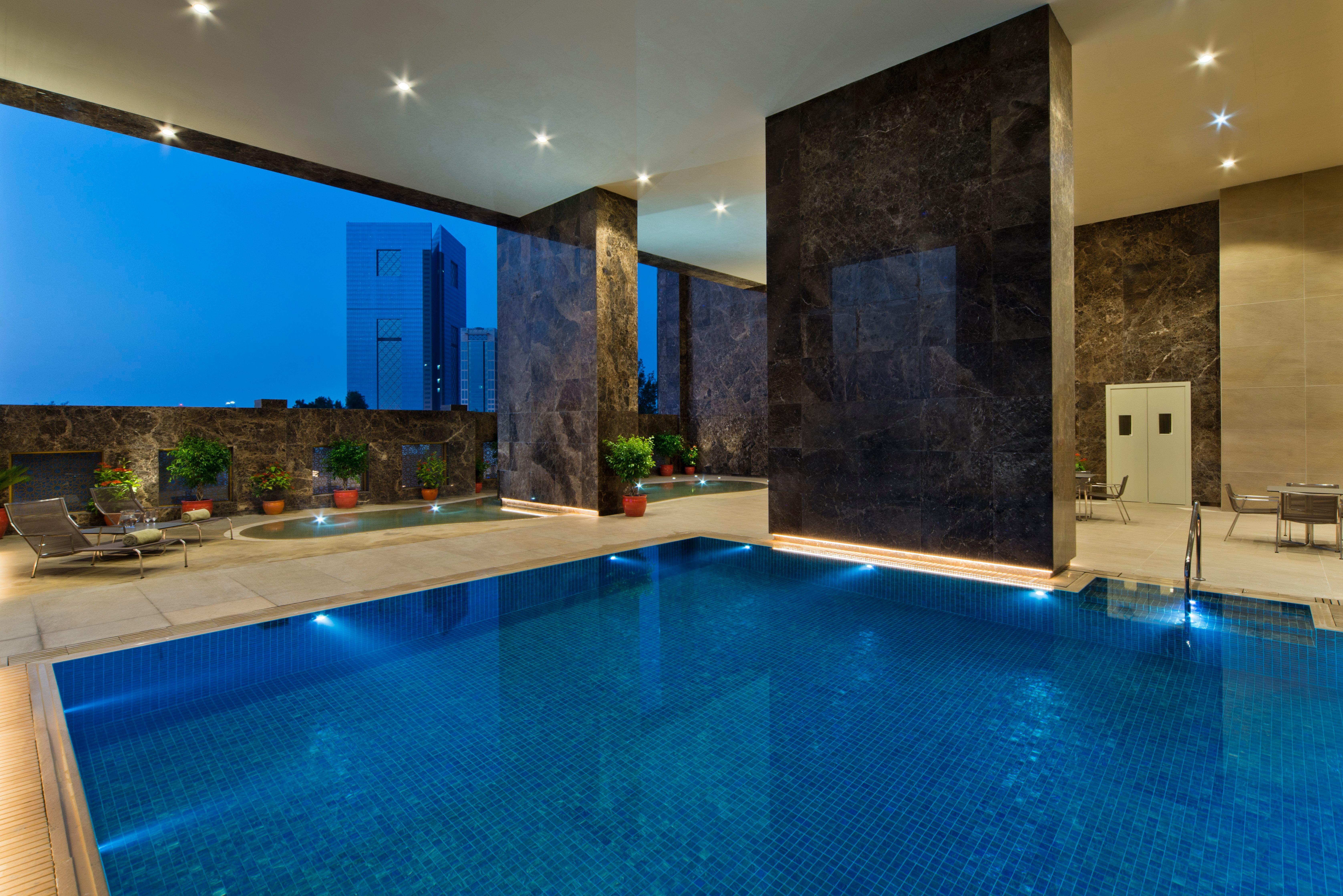 Voco Doha West Bay Suites By Ihg Exterior photo The swimming pool at the hotel