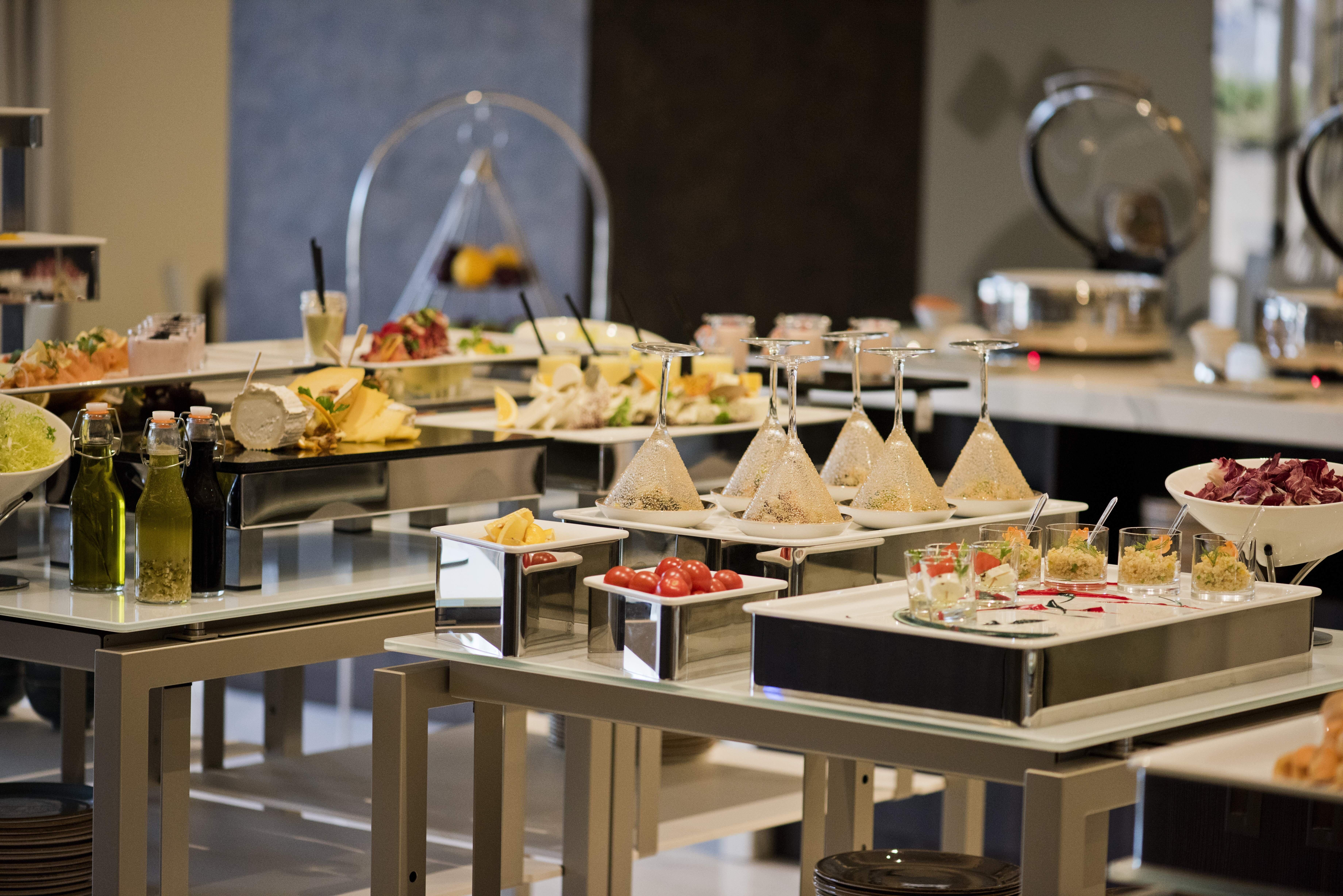 Voco Doha West Bay Suites By Ihg Exterior photo A buffet at a hotel