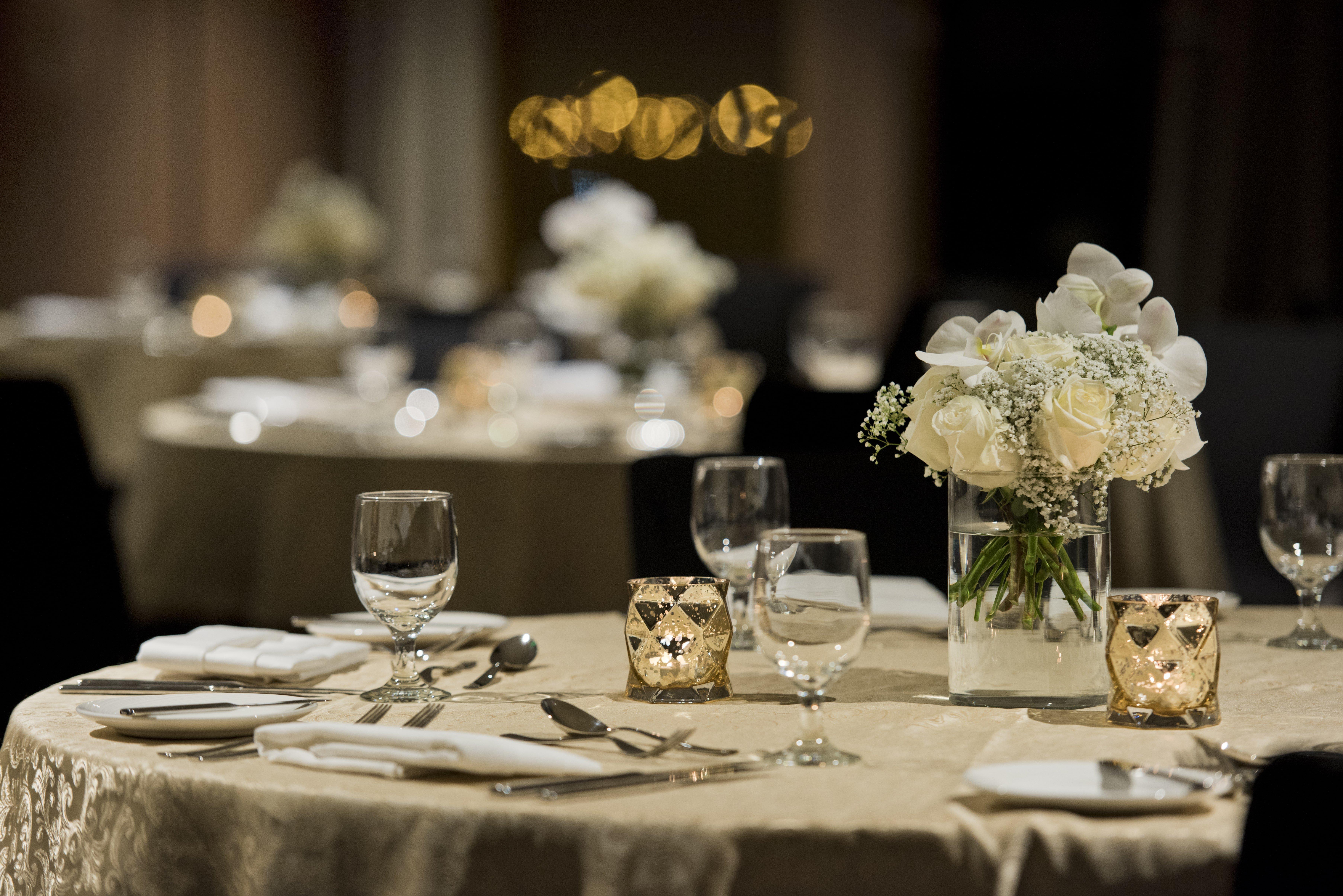 Voco Doha West Bay Suites By Ihg Exterior photo A table set for a formal dinner