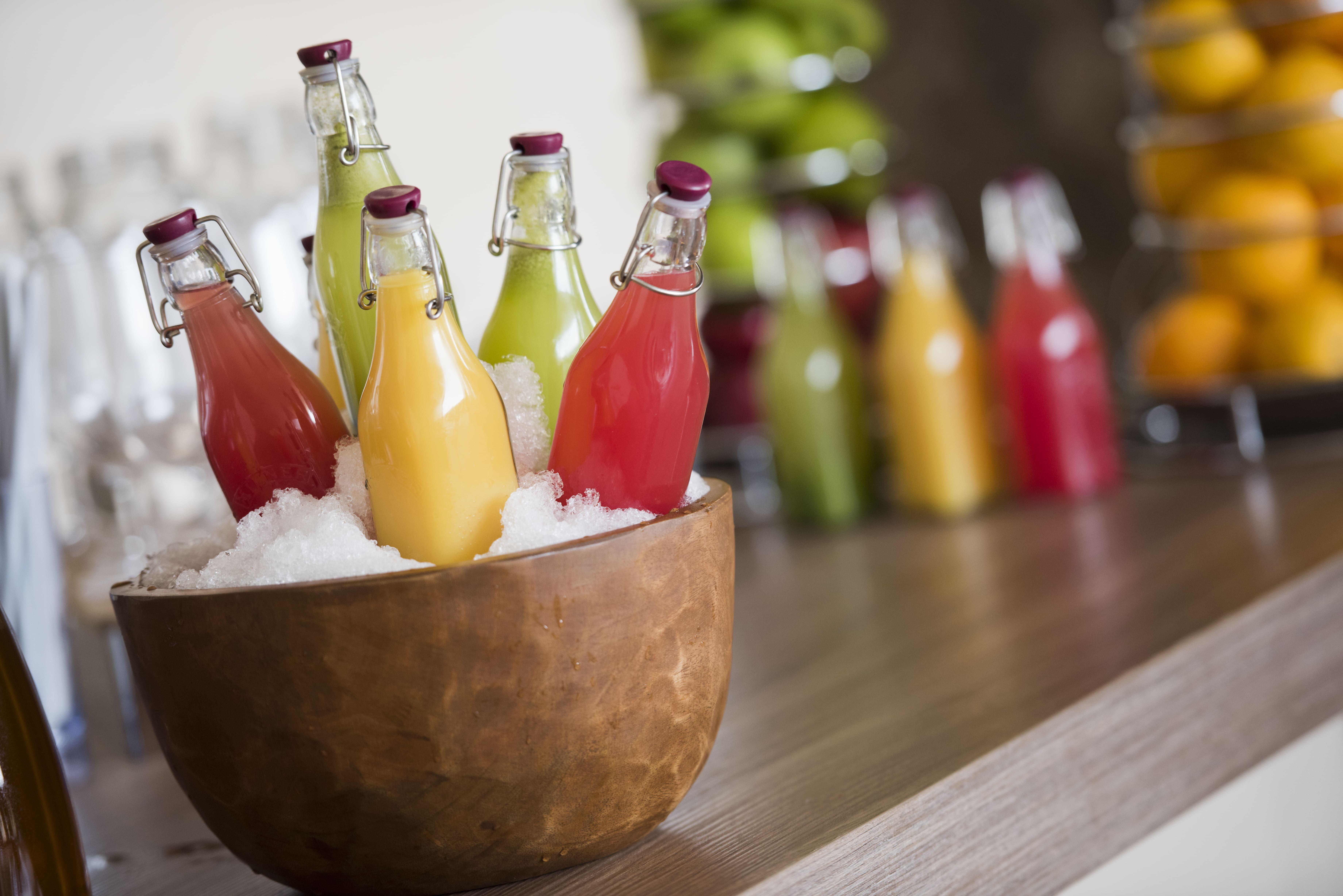Voco Doha West Bay Suites By Ihg Exterior photo Bottles of juice