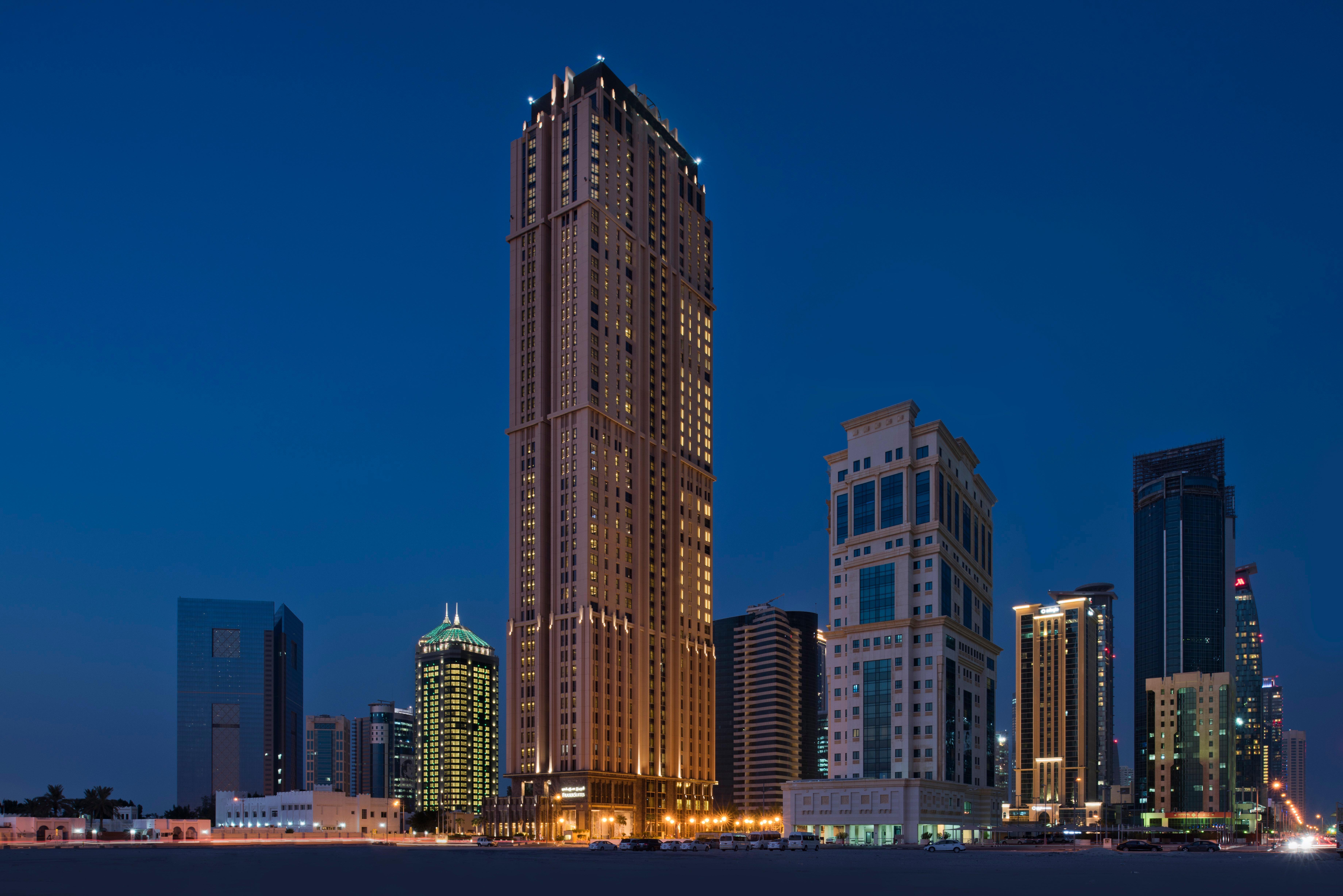 Voco Doha West Bay Suites By Ihg Exterior photo The hotel at night