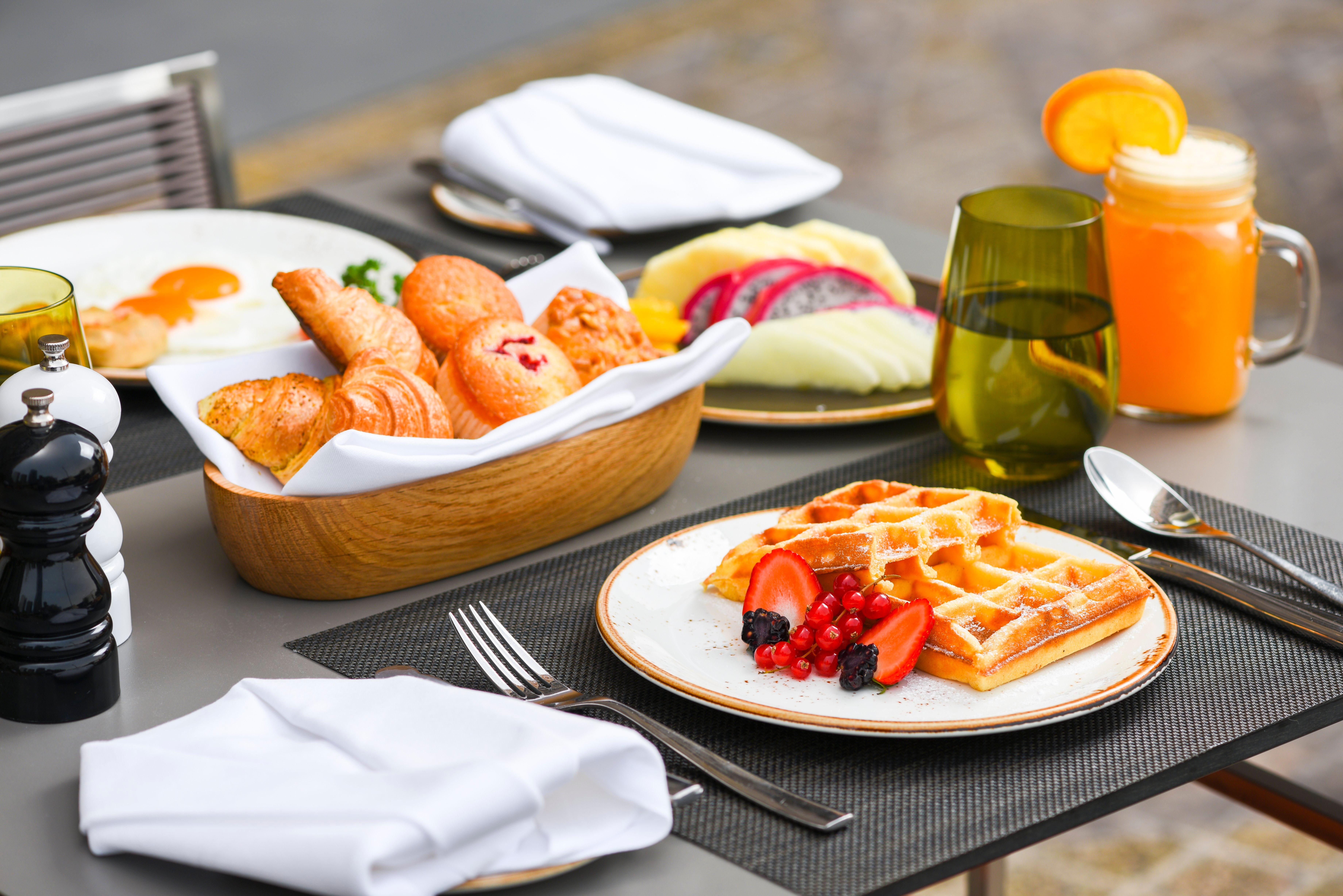 Voco Doha West Bay Suites By Ihg Exterior photo A breakfast at the hotel