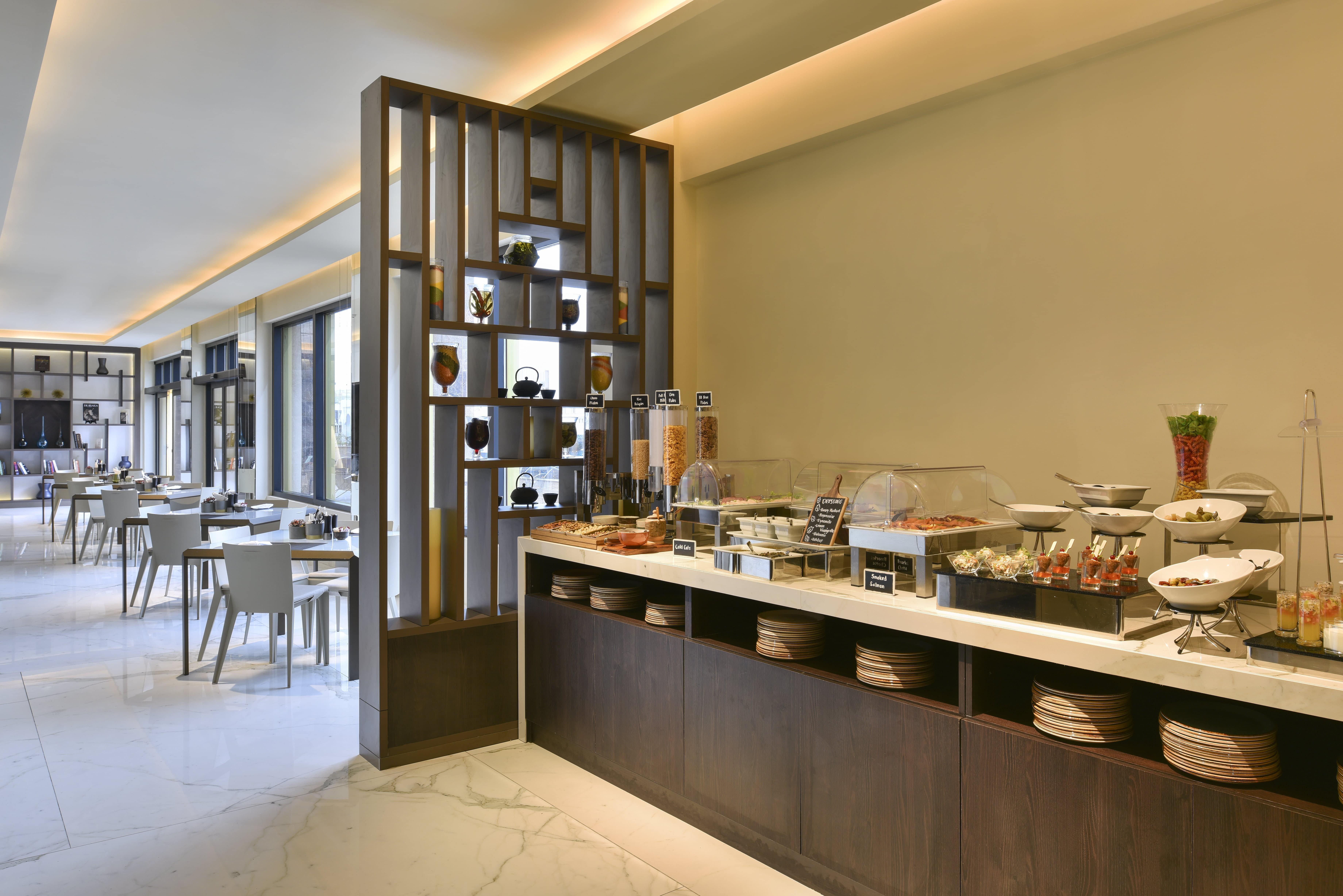 Voco Doha West Bay Suites By Ihg Exterior photo The restaurant at the hotel
