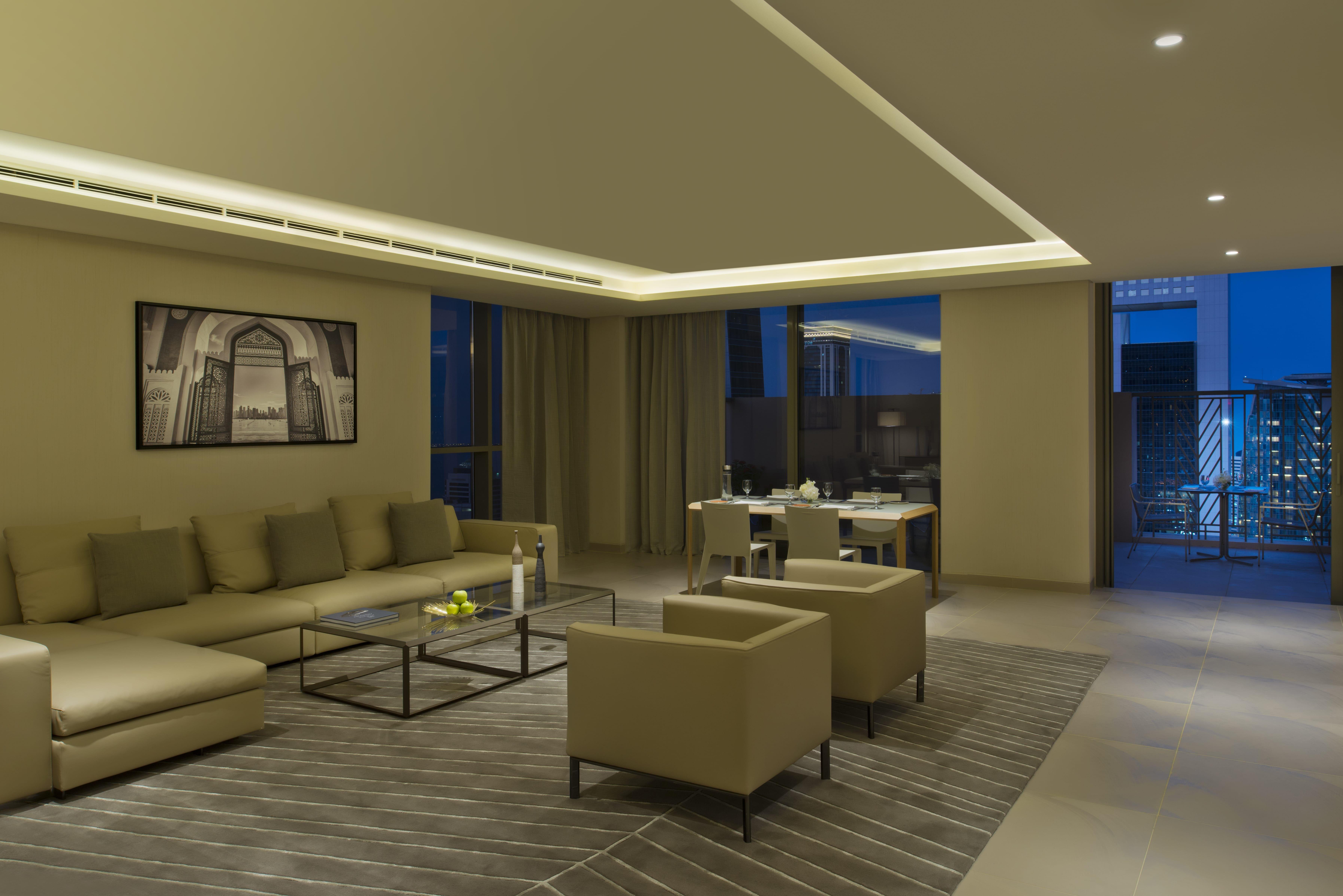 Voco Doha West Bay Suites By Ihg Exterior photo A living room in a typical apartment