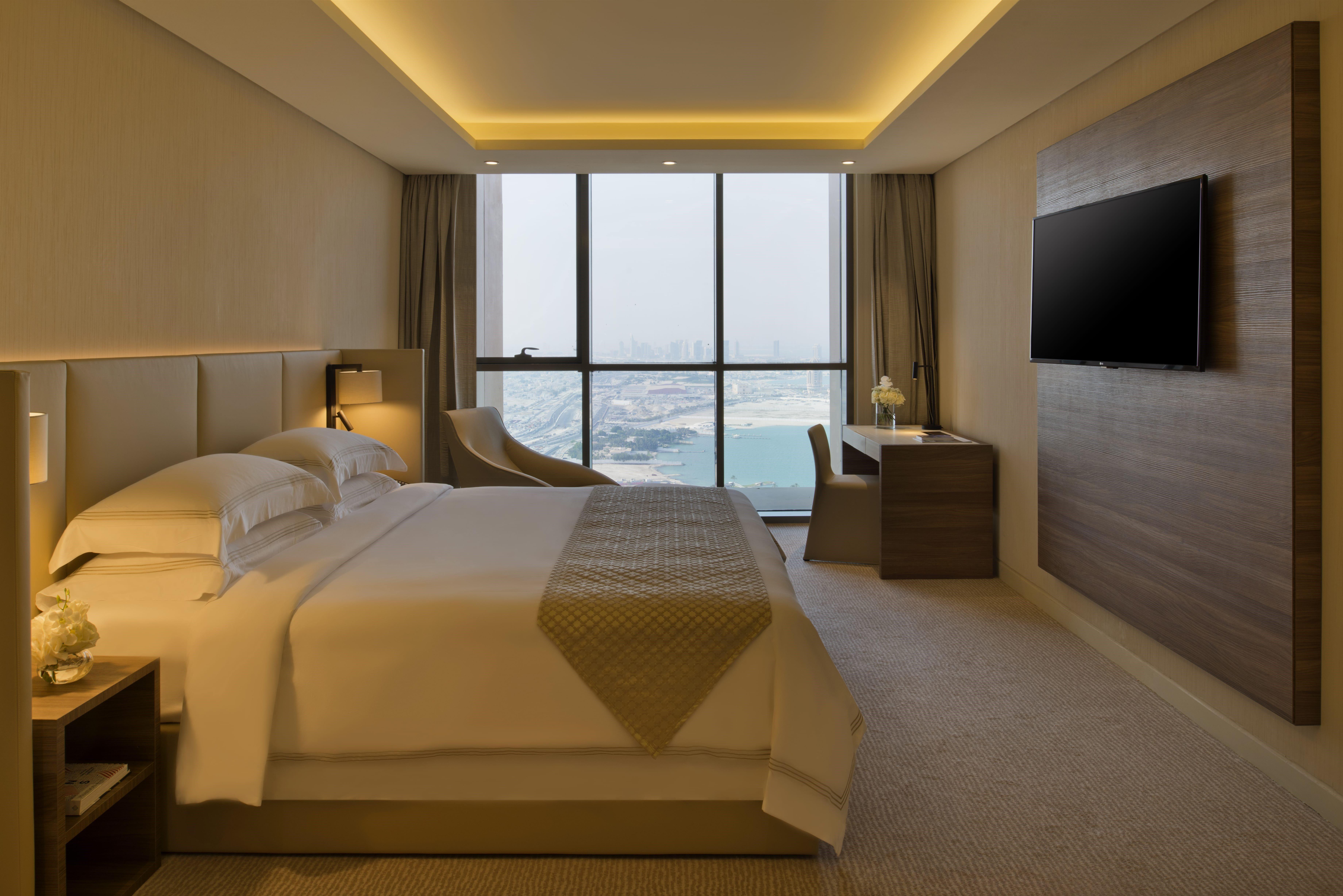 Voco Doha West Bay Suites By Ihg Exterior photo A bedroom at the hotel